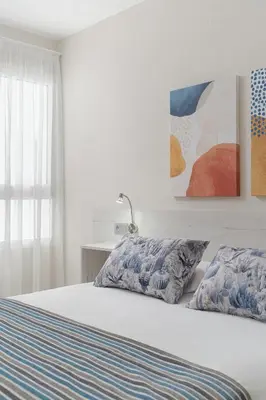 Cama o camas de una habitación en Las Afortunadas - Playa Arinaga 2ºD