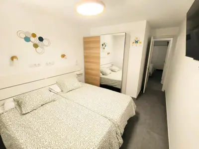Cama o camas de una habitación en Acogedor Octavo Hábitat by CASAS COCODRILO