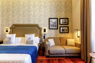 Cama o camas de una habitación en Boutique Hotel Cordial Plaza Mayor de Santa Ana
