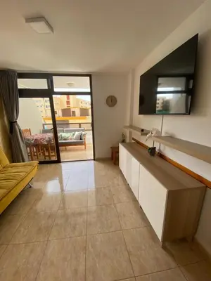 Una televisión o centro de entretenimiento en Apartament Modern 1 Playa del Ingles