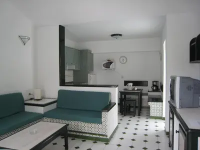 Una televisión o centro de entretenimiento en Bungalows Campo Golf