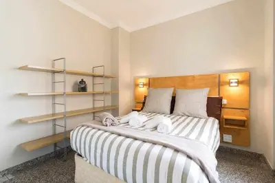 Cama o camas de una habitación en Atamanja Beach Apatment Playa de Las Canteras