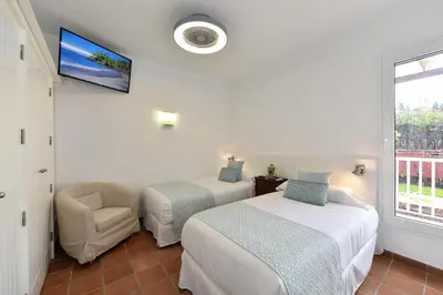 Cama o camas de una habitación en El Flamboyan Golf by VillaGranCanaria