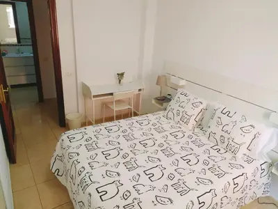Cama o camas de una habitación en Playa Canteras Aqui Te Espero