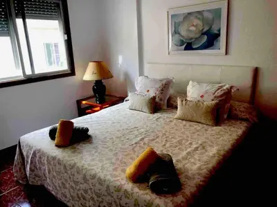 Cama o camas de una habitación en Luminoso y acogedor