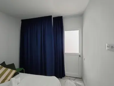 Cama o camas de una habitación en HOLA SUITE