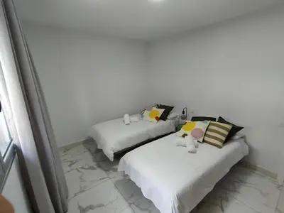 Cama o camas de una habitación en HOLA SUITE