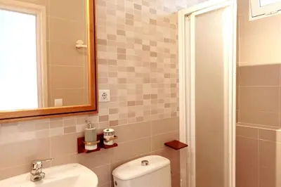 Un baño de Apartment with large terrace, 10 meters from Playa de las Burras