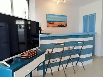 Una cocina o zona de cocina en Apartment with large terrace, 10 meters from Playa de las Burras