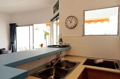 Una cocina o zona de cocina en Apartment with large terrace, 10 meters from Playa de las Burras