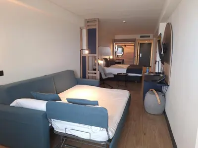 Cama o camas de una habitación en Sercotel Playa Canteras