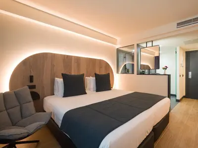 Cama o camas de una habitación en Sercotel Playa Canteras