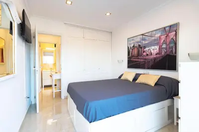 Cama o camas de una habitación en APARTAMENTO SCORPIO 514 by Homestaygrancanaria