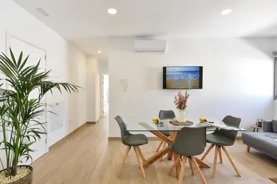 Una televisión o centro de entretenimiento en Apartamento Starlight La Aldea I