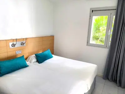 Cama o camas de una habitación en Servatur Riosol