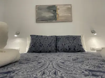 Cama o camas de una habitación en SAN AGUSTIN SEAVIEW BLUE APARTMENT