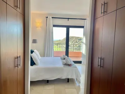 Cama o camas de una habitación en HomeForGuest Villa 10 in Salobre Golf with great views to the golf course