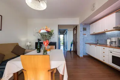 Una cocina o zona de cocina en Apartamentos El Paseo