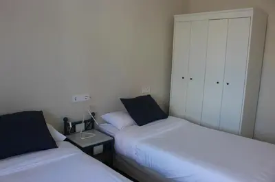Cama o camas de una habitación en La Casona de Galdós