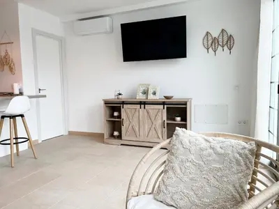 Una televisión o centro de entretenimiento en Casa Las Fresas
