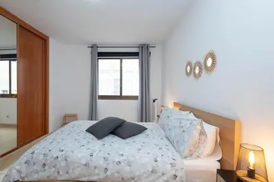 Cama o camas de una habitación en GuestReady - BKD1 A tan solo 50 metros de la playa Las Canteras