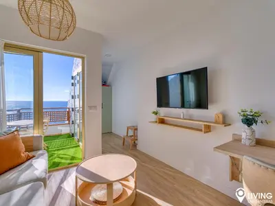 Una televisión o centro de entretenimiento en Living Las Canteras Homes - BEACHFRONT IN STYLE