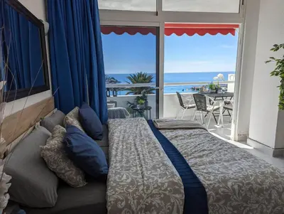 Cama o camas de una habitación en Beachfront studio apartment Puerto Rico