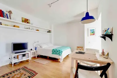 Una televisión o centro de entretenimiento en Living Las Canteras Homes - A HOME AWAY FROM HOME