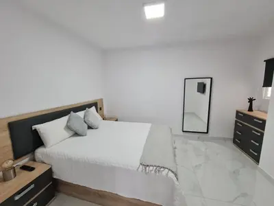 Cama o camas de una habitación en ENZO SUITE