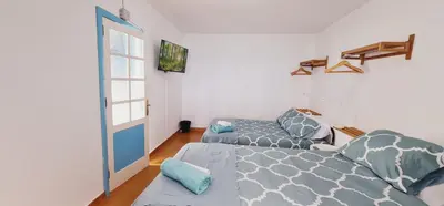 Cama o camas de una habitación en Salema casa de playa en San Cristobal