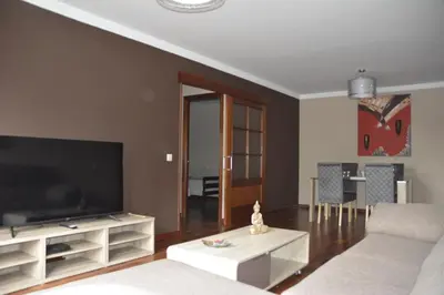 Una televisión o centro de entretenimiento en Apartamento complejo residencial