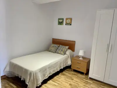 Cama o camas de una habitación en HomeForGuest Amplio apartamento con piscina y terraza en Mogan