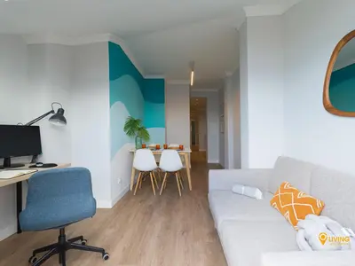 Una televisión o centro de entretenimiento en Living Las Canteras Homes - SEA BREEZE BEACHFRONT