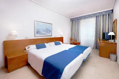 Cama o camas de una habitación en Hotel Concorde