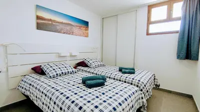 Cama o camas de una habitación en mirador del 6th by CASAS COCODRILO