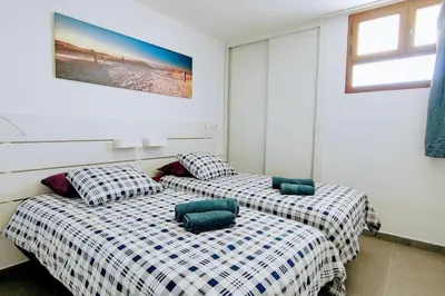 Cama o camas de una habitación en mirador del 6th by CASAS COCODRILO
