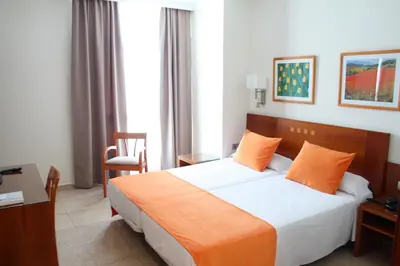 Cama o camas de una habitación en Hotel Pujol