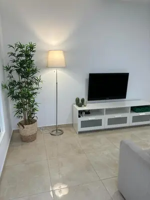 Una televisión o centro de entretenimiento en House Isleta Dream