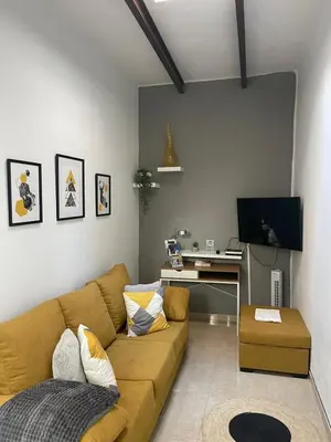 Una televisión o centro de entretenimiento en Casa BIMBA Agaete con terraza y ducha exterior