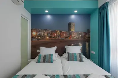 Cama o camas de una habitación en Petit Accommodation Las Canteras Premier