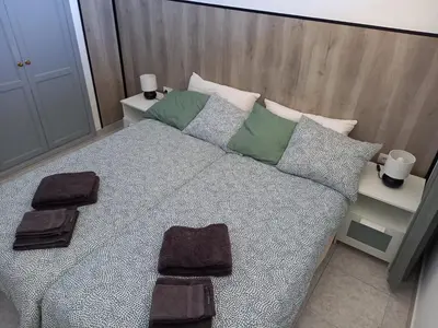 Cama o camas de una habitación en Yumbo Holiday Apartment - Tanife CAS