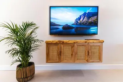 Una televisión o centro de entretenimiento en Coral Canteras Loft by Gestión Vacacional Canarias