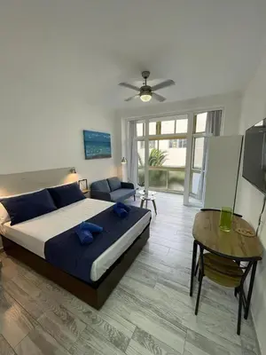 Cama o camas de una habitación en PALMERAS 102