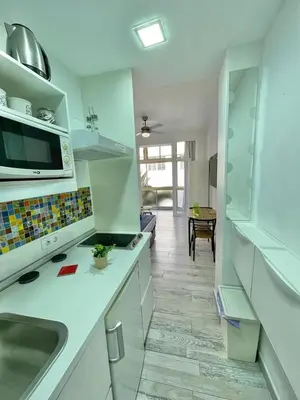 Una cocina o zona de cocina en PALMERAS 102