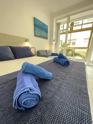 Cama o camas de una habitación en PALMERAS 102