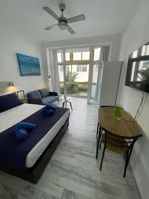 Cama o camas de una habitación en PALMERAS 102