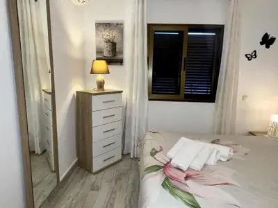 Cama o camas de una habitación en Dowtown Holiday Home in Playa del Ingles