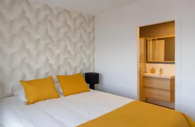 Cama o camas de una habitación en Apartamento frente a la playa de Las Canteras S2