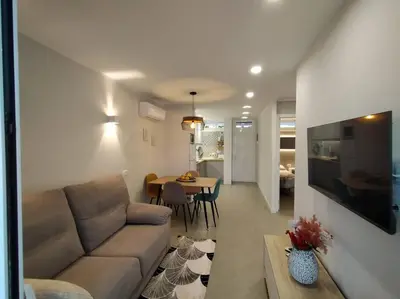 Una televisión o centro de entretenimiento en Holiday Apartment Alegranza