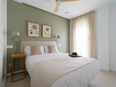 Cama o camas de una habitación en Royal Suites-Viviendas Vacacionales